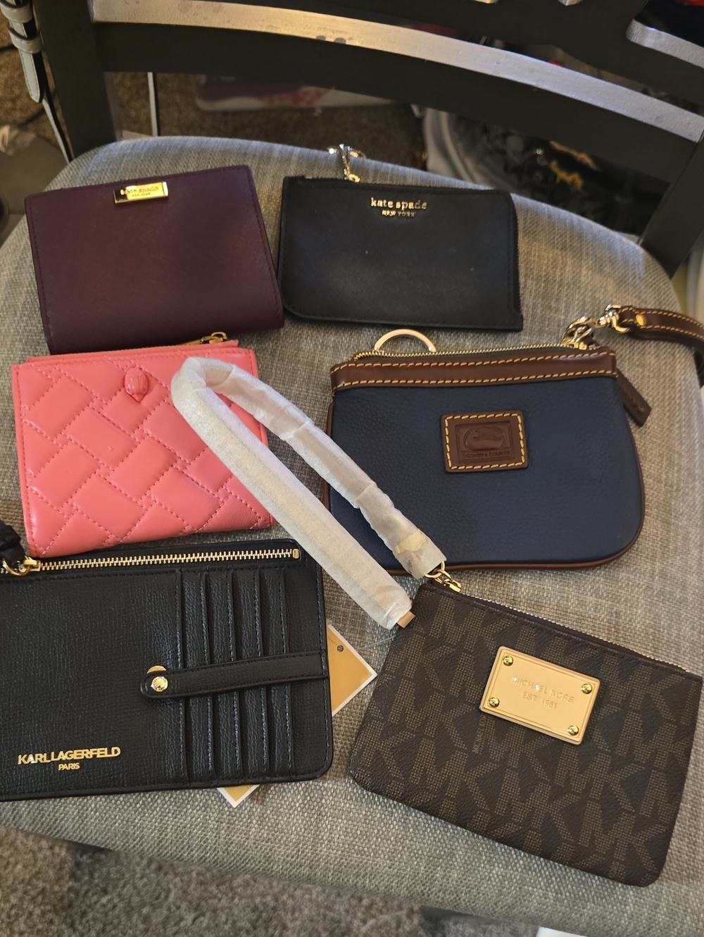 kate spade navy and black leather wristlet with gold accents